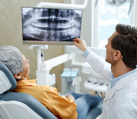 Dental implant consultation between patient and dentist