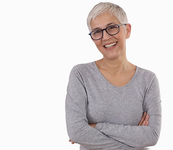 Woman wearing gray shirt with dental implants