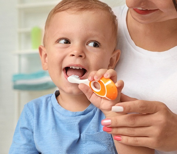 Close-up of a child’s white, healthy smile