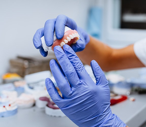 Lab technician creating a set of dentures
