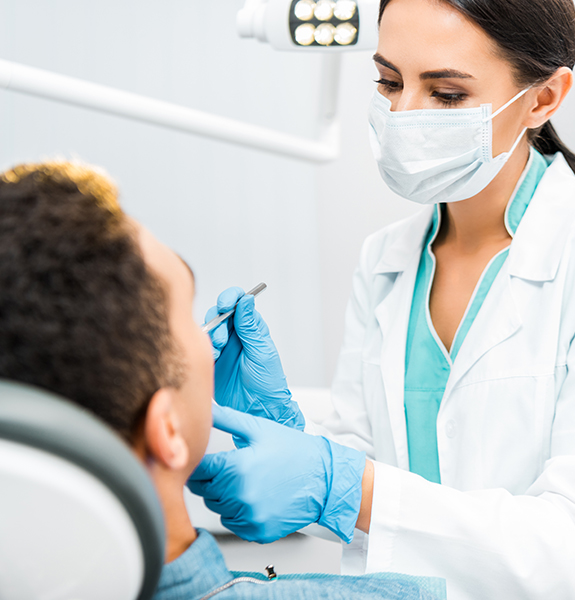 Dentist treating dental patient