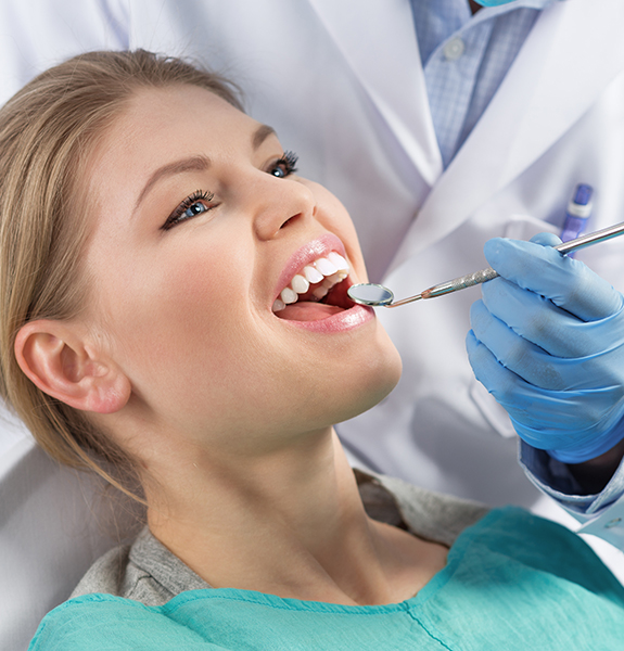 Woman receiving periodontal therapy