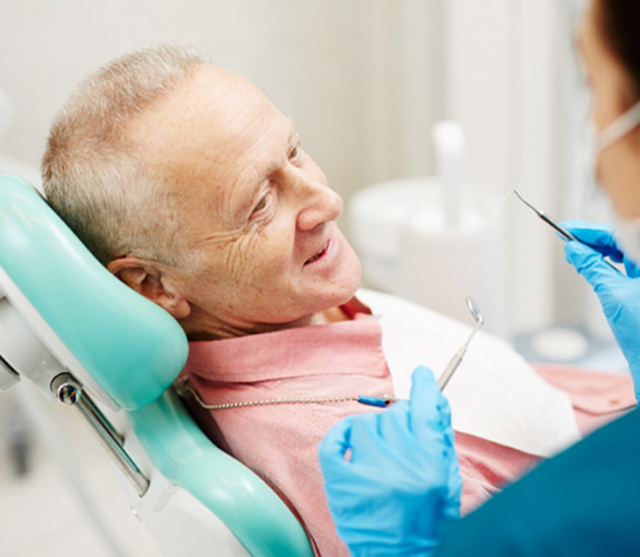 Man visiting the dentist for a checkup 