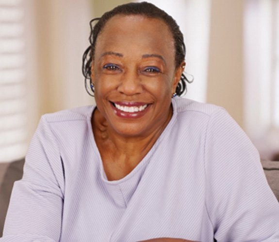 Healthy woman with dental implants in Wilmington 