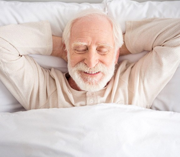 Man asleep with dental implants