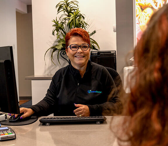 Patient filling out dental insurance forms