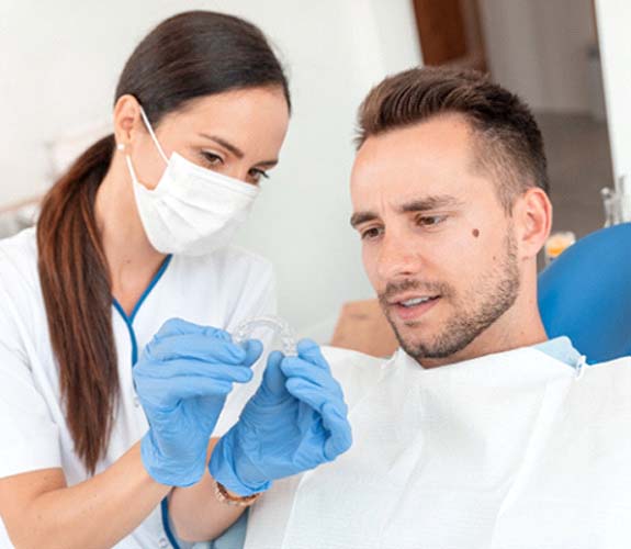 Patient and dentist discussing Invisalign in Wilmington