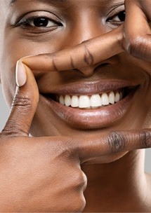 Woman outlining her smile with her fingers