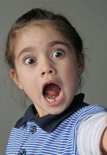 Little girl surprised at her knocked-out tooth