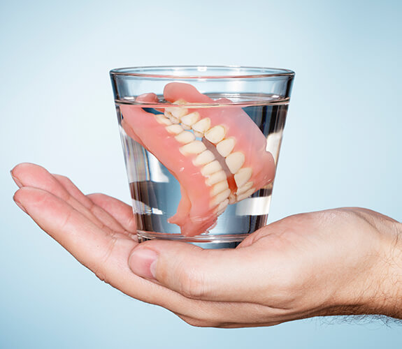 Dentures in a glass of water