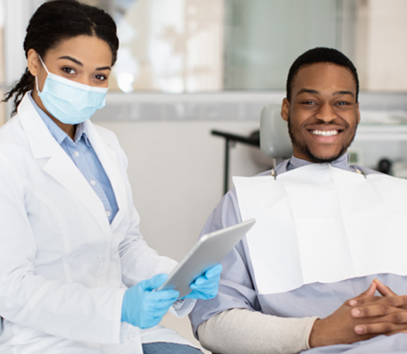 Male patient smiling in the dentist’s chair 