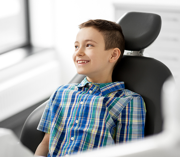 Young boy in dental chair for children's dentistry