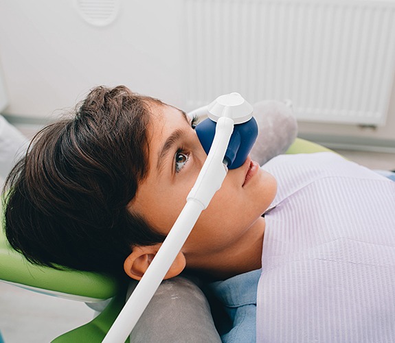 Relaxed child receiving sedation dentistry treatment