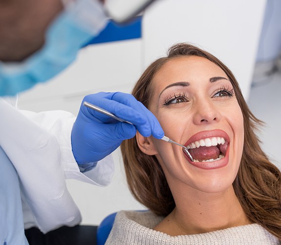 Woman receiving dental cleaning