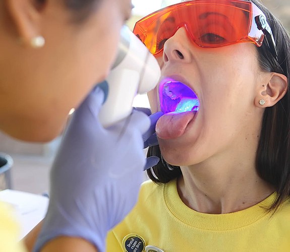 Patient receiving oral cancer screening