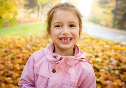 Little girl sharing healthy smile after children's dentistry visit