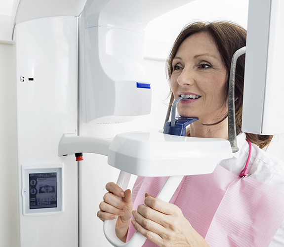 Woman receiving 3 D C T cone beam x-ray scan