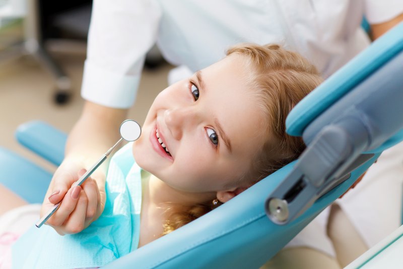 Little girl visiting the dentist